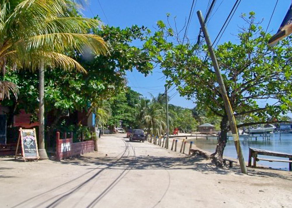 sandy main street in West Bay Roatan, Honduras