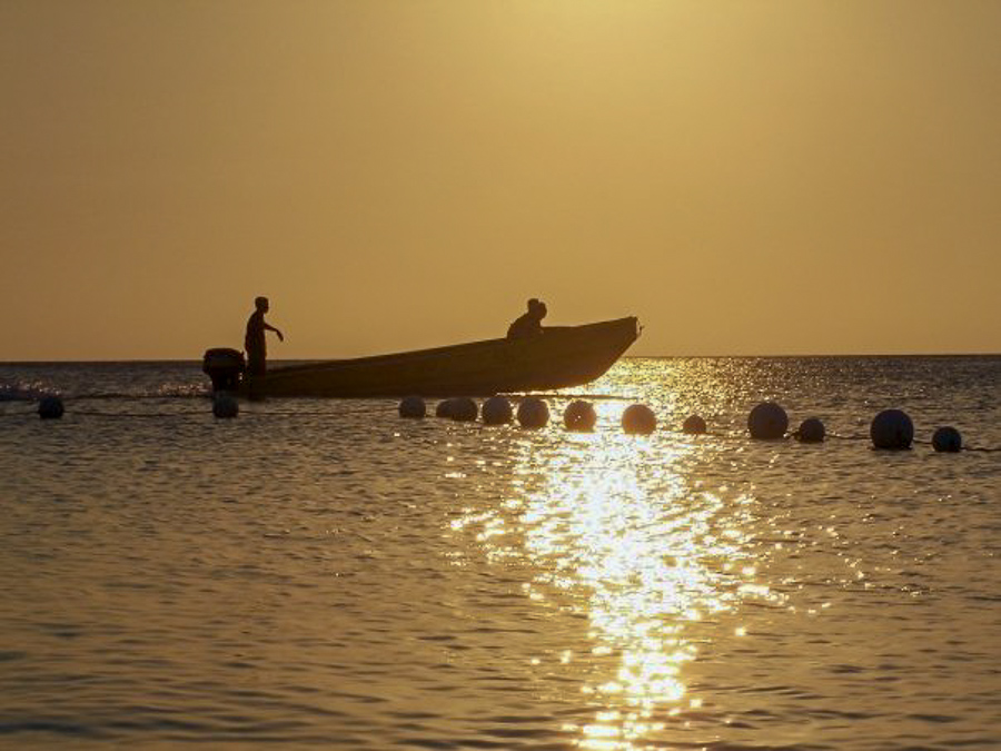 sunset at Henry Morgan Courtyard beach in West Bay in Roatan, Honduras