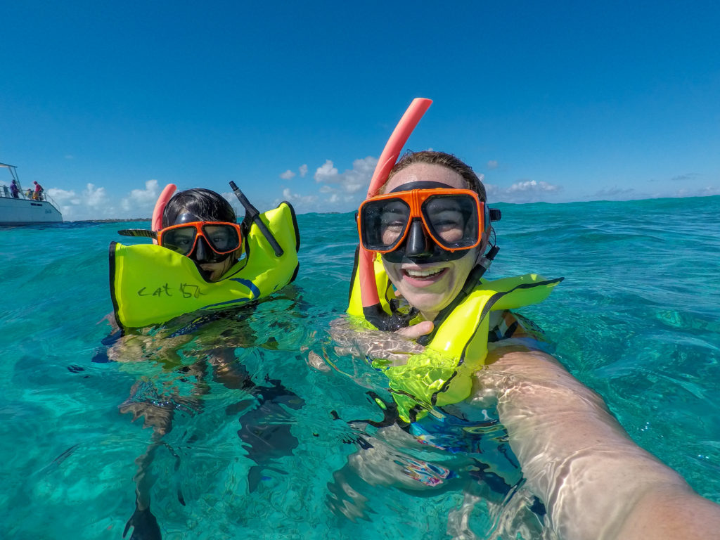 Mother and daughter snorkeling at Grace Bay beach