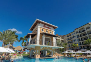 Swim up bar in Italian Village pool and Beaches marque sign. What To Expect When You Arrive at Beaches Turks and Caicos Resort. Here's the low down on what you need to know #beachesresorts #beachesturksandcaicos #beachesresorts #turksandcaicos #allinclusiveturksandcaicos #pls #providenciales #beachesmoms #beachvacations #allinclusivebeachvacations #familyallinclusive #bestallinclusive #familytravelblogger #bestfamilytravleblogger #femaletravelblogger #torontomom