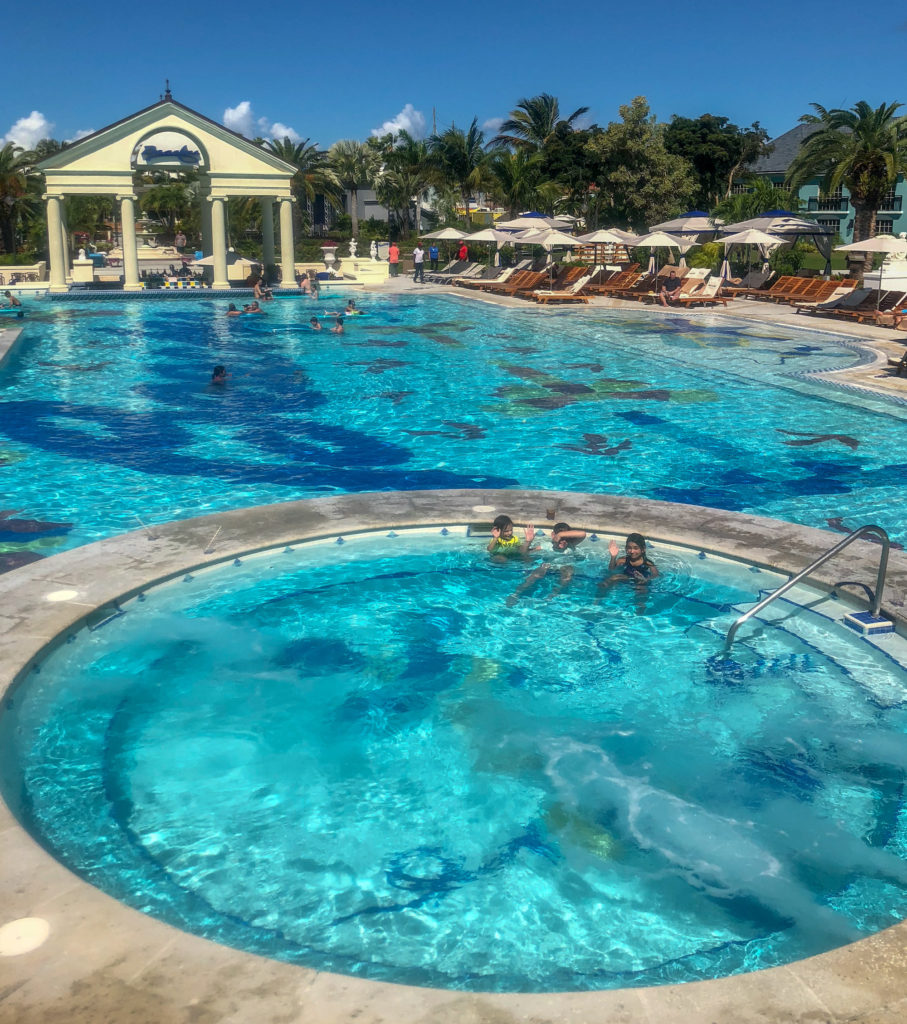 French Village feature pool, swim up bar and hot tub from above