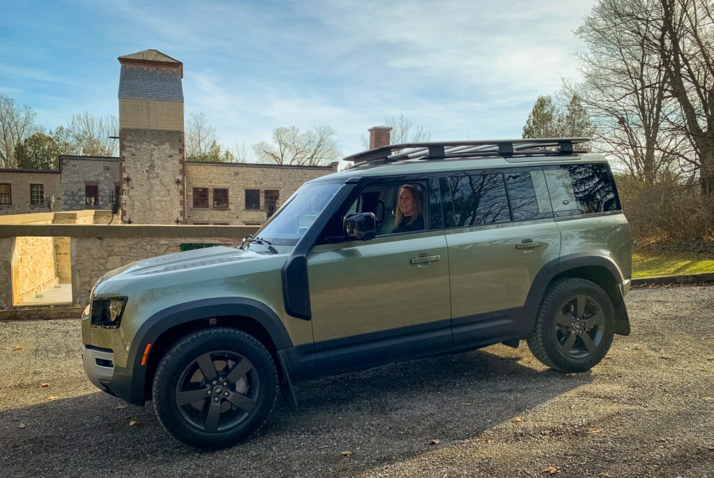 Land Rover Defender being driven by Kathryn at Alton Mills, Caledon, Ontario Road Trip. Photo by Jay Kana / Modern Mississauga