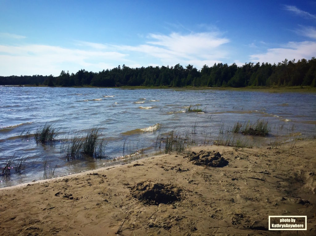 Tobermory Beach, singing sands beach - Top 5 Things To Do In Tobermory, Ontario #topfivelist #tobermory #singingsandsbeach #provincialpark #brucepeninsula #flowerpotisland #thegrotto #brucepeninsulagrotto #parkscanada #smalltownsinontario #familytravelvlogger #familytravelblogger #ontariobloggers #ontarioroadtrips #thingstodoinontario #thingstodointobermory