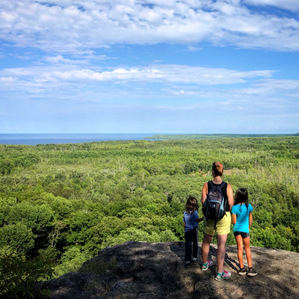 My and my kids on Skinner's Bluff look out. Bruce County Adventure #brucetrail #skinnersbluff #wiartonontario #epichikes #hikewithkids #takeyourkidseverywhere