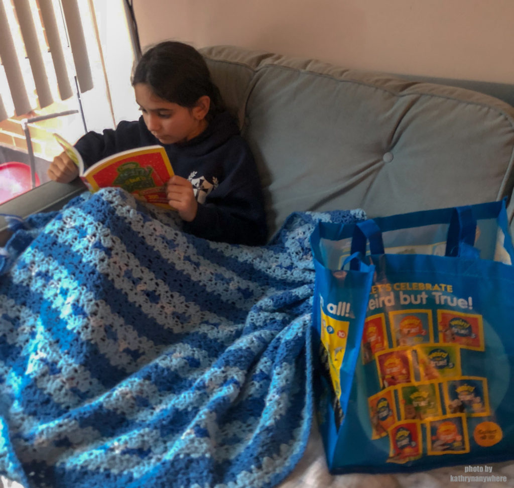 Child reading Weird But True Christmas