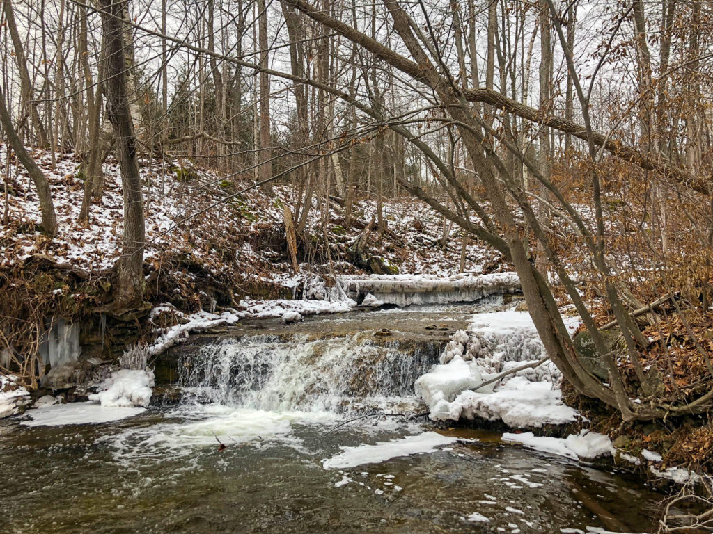 Beautiful Frozen Waterfall on hike in Silvercreek Conservation Area #silvercreekconservationarea #brucetrail #womenwhoexplore #womenwhoexploreontario #discoveron  #ontarioforyou  #girloutdoor #girlsthatwander  #hikingculture #gogalavanting  #girlswhohike #explorecanada