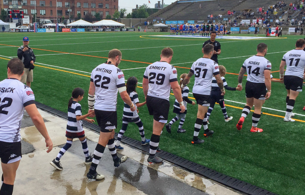 Miss M of the Toronto Nomads Junior team escorts Toronto Wolfpack player onto field #runwiththepack #defendtheden #torontowolfpack #torontonomads #rugbygirl