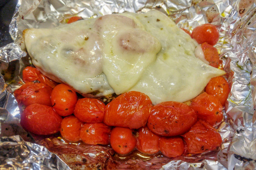 Cooking while winter camping at MacGregor Point Provincial Park in February! We wrapped chicken breasts, cherry tomatoes and provolone cheese in tin foil and put it on the BBQ #findyourselfhere #macgregorpointprovincialpark #macgregorpoint #macgregorpp #ontarioparks #yurtcamping #wintercamping #outdoors #adventureparenting #portelgin #brucepeninsula #campcooking PHOTO BY BRIAN TAO LUXOGRAPHY