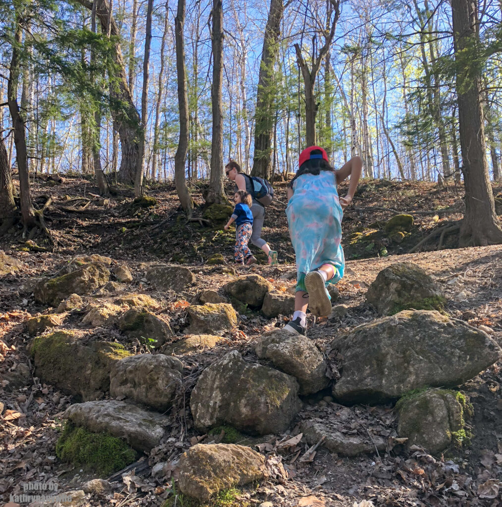 climbing over some rocks at mono cliffs provincial park