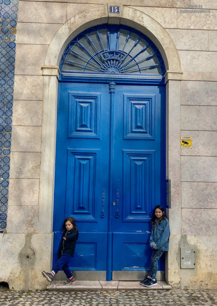 The doors of Lisbon, Barcelona and Paris. This beautiful, blue door my kids are posing in front of is from in the Bairro Alto district in the city of Lisbon