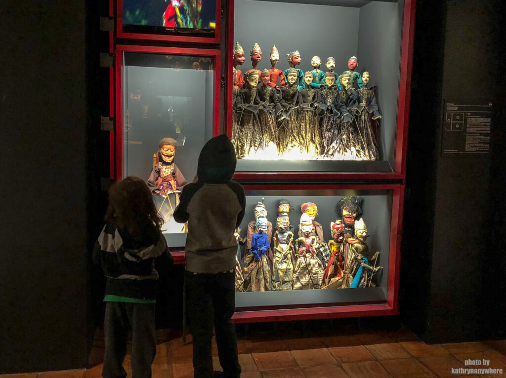 My kids checking out a display in Museum of the Marionette, The Marionette Museum In Lisbon, The Puppet Museum, Museu da Marioneta, Lisbon Portugal, Lisboa