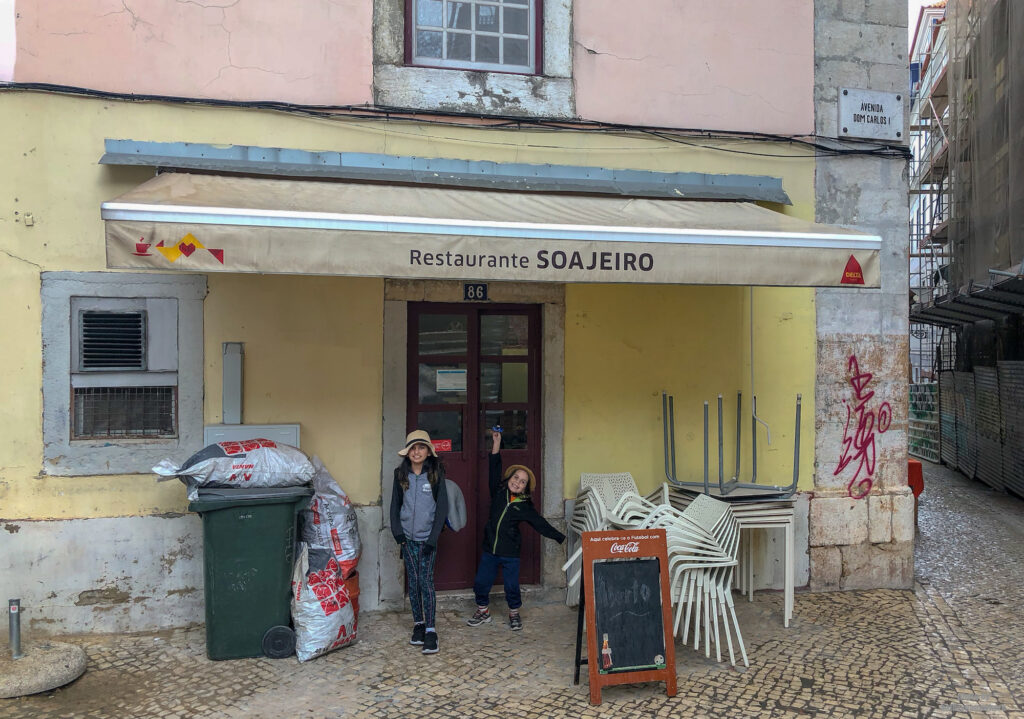 Restaurante SoaJeiro in Lisbon, Portugal exterior with my kids posing in front of it