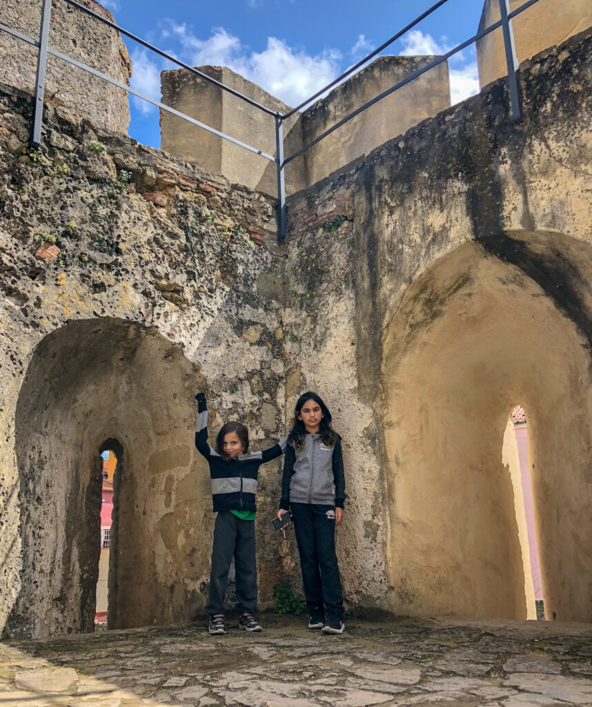 inside the grounds of Castelo Sao Jorge with Miss M and Little Man