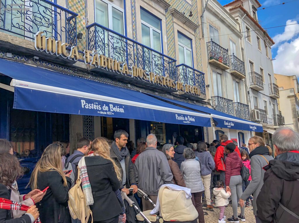 The outside line up madness of Pastéis de Belém in Lisbon, Portugal. This was an added stop in our Lisbon itinerary