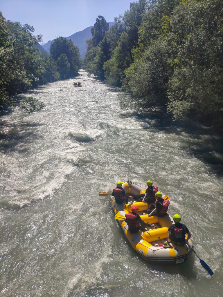 Two rafts on the Isere River water water rafting. We are the boat in the back.
