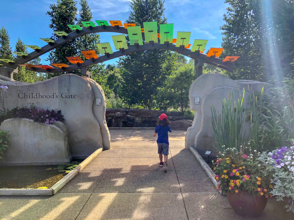 Little Man running through the Childhood's Gate at the Penn State Arboretum
