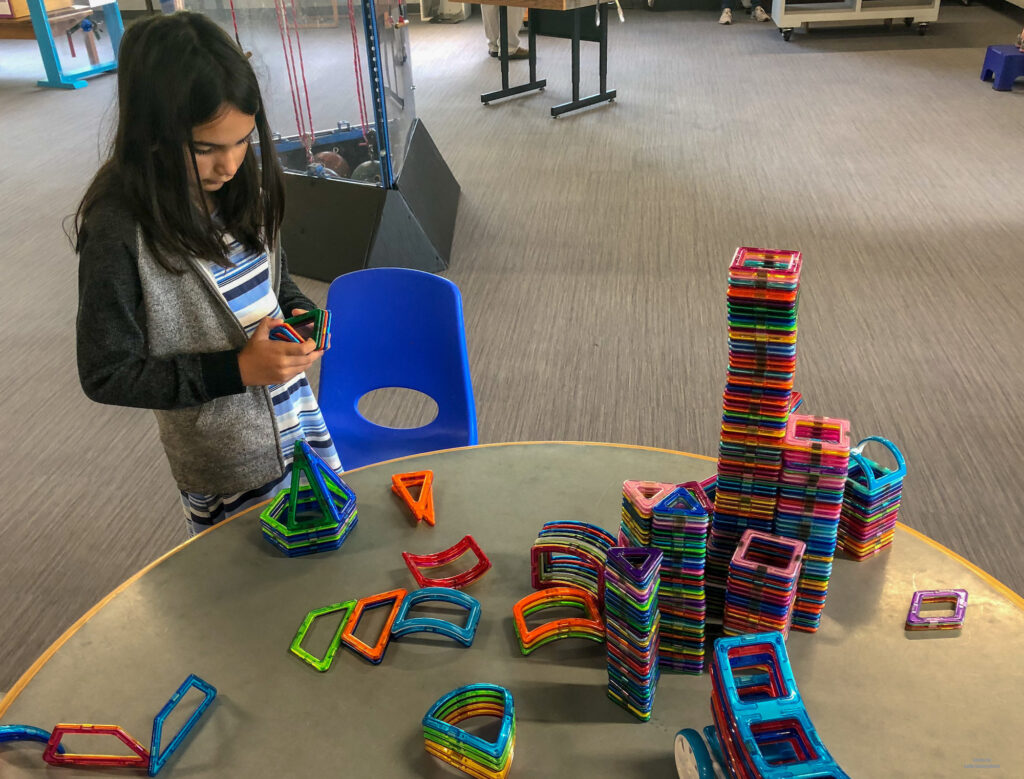 Miss M learning about magnets in Discover Space in State College, PA