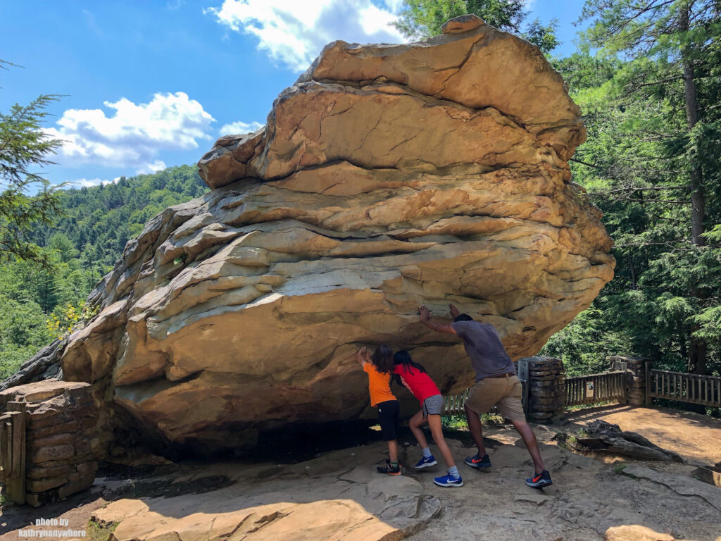 Trying to tip over balanced rock in Trough Creek State Park, Pennsylvania
