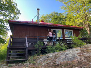 My mom and children on a deck of our 2 bedroom cottage at Viamede Resort
