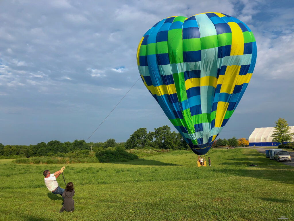 End of the hot air balloon ride. Little Man assisting with pulling down the balloon