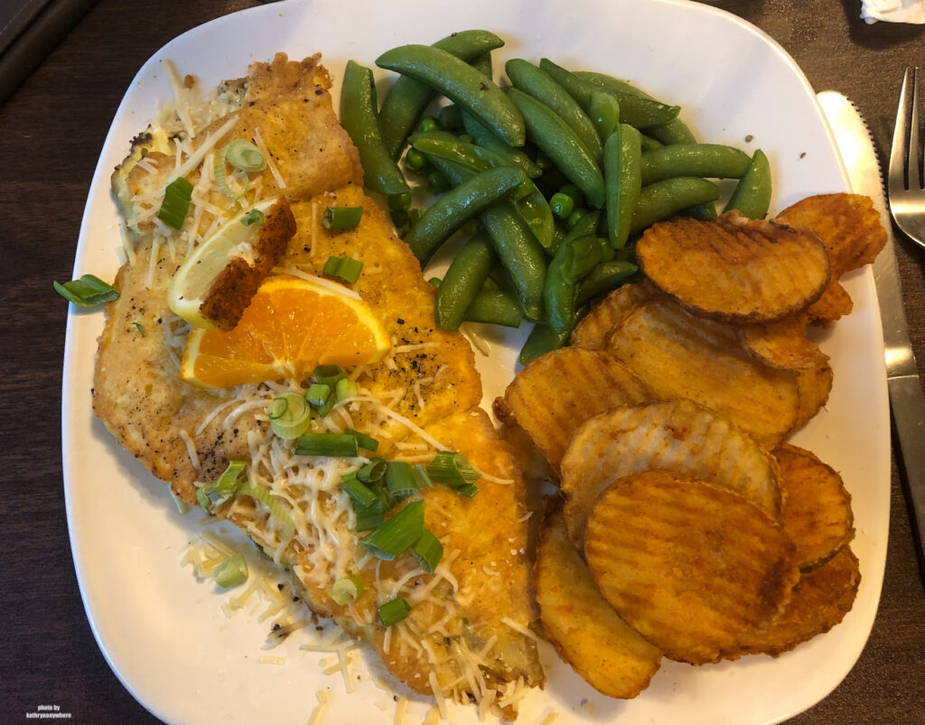 fish dinner at exterior of Edgewater Inn & Riverside Grille