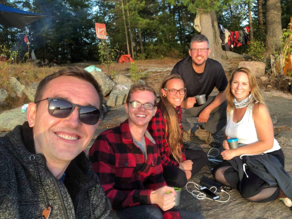 Travel writers on portage, back country canoe portage and camping trip