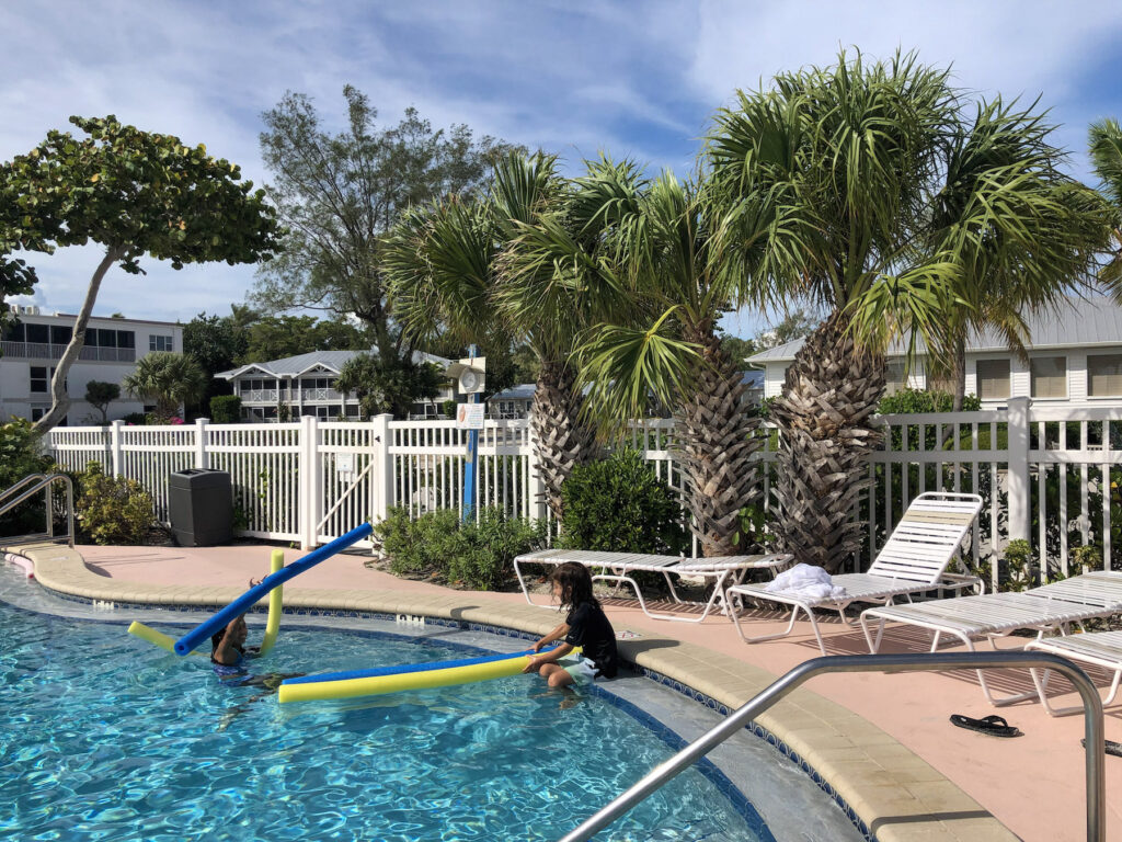My kids enjoying fun with pool noodles in the pool of Island Inn on Sanibel Island 2