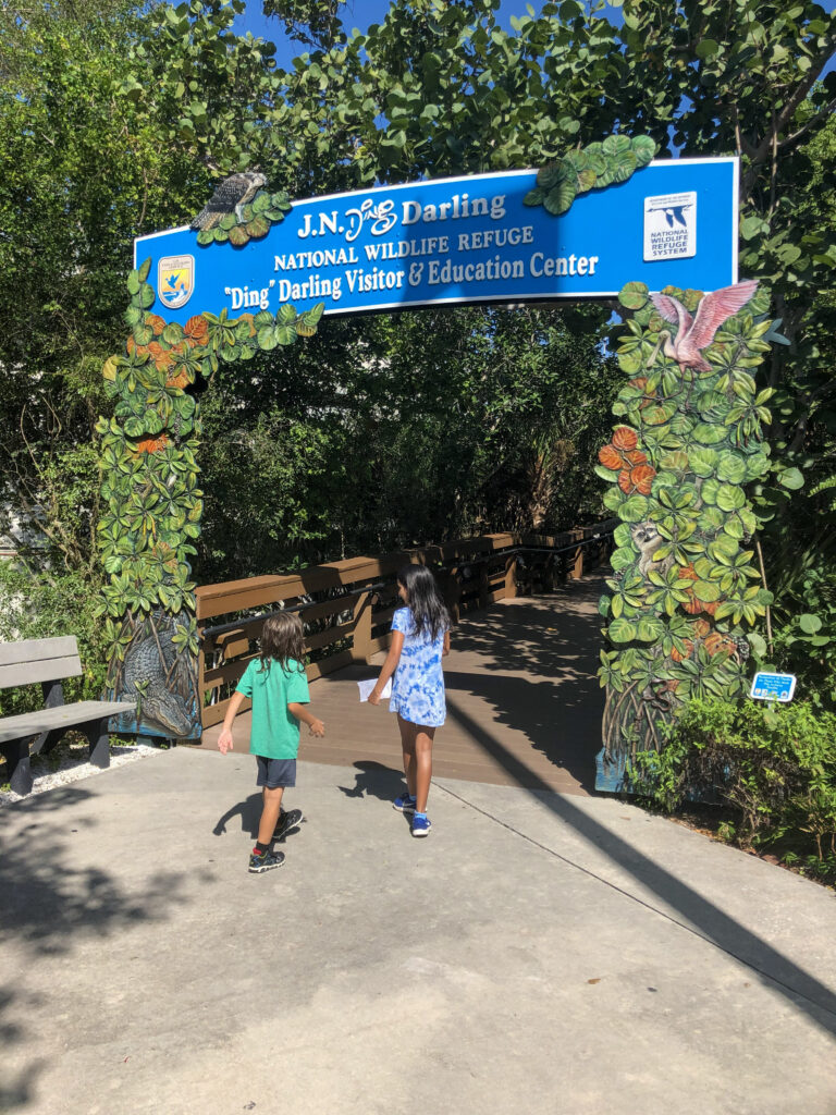 My kids walking up to J.N. Ding Darling National Wildlife Refuge visitor centre entrance on Sanibel Island in Florida