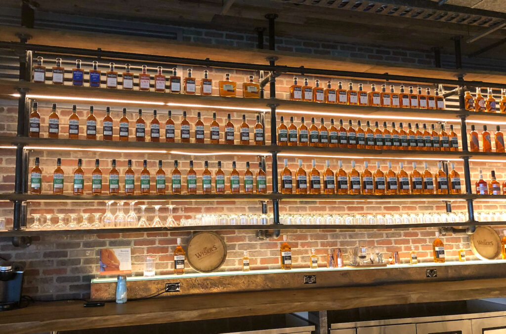 selection of whiskey in J.P. Wiser's distillery bar in the shop