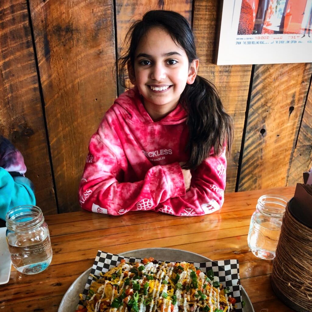 Miss M having tacos at Tucos Taco Lounger, Sudbury