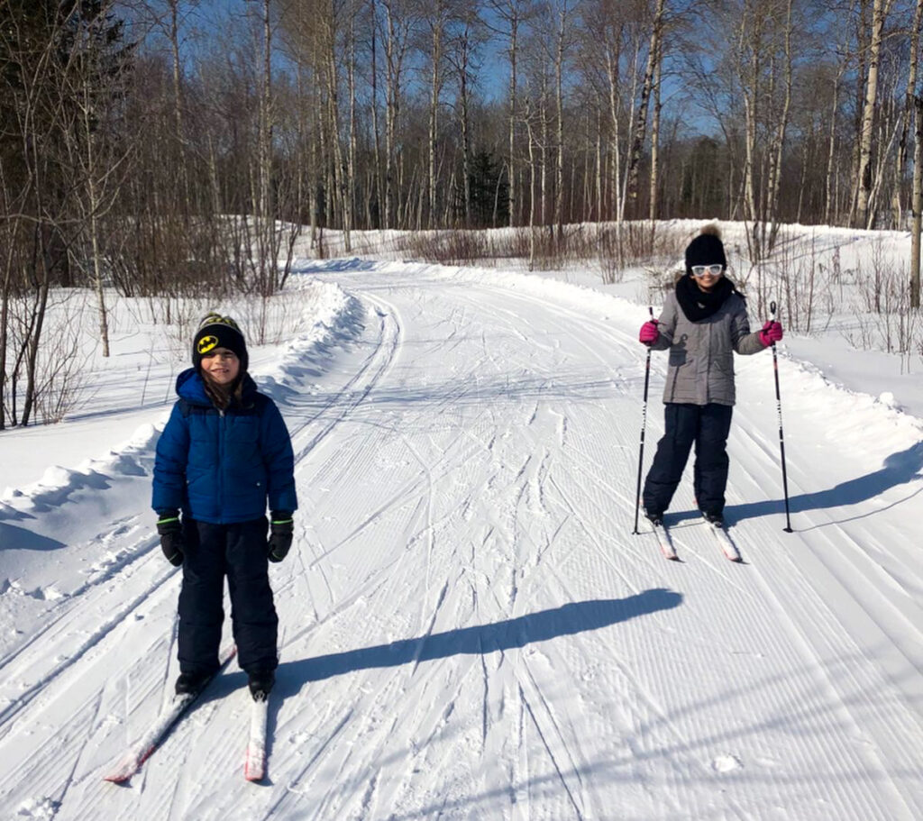 Sudbury Winter Activities kids cross country skiing on groomed trail in Kivi Park