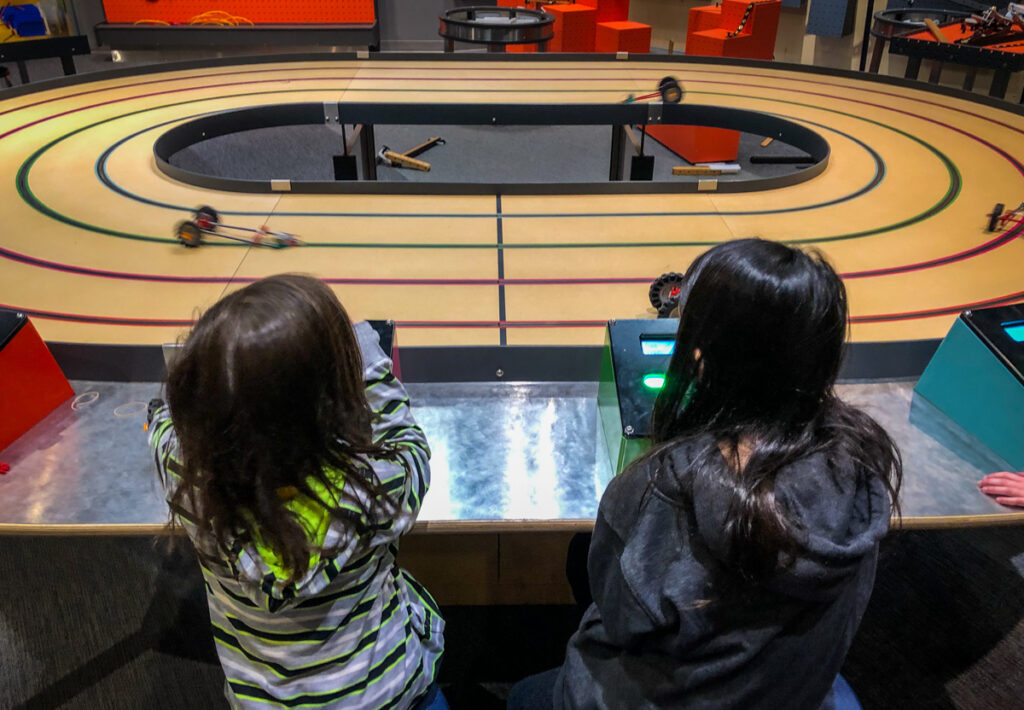 Racing the cars the kids made on the fourth floor of Science North