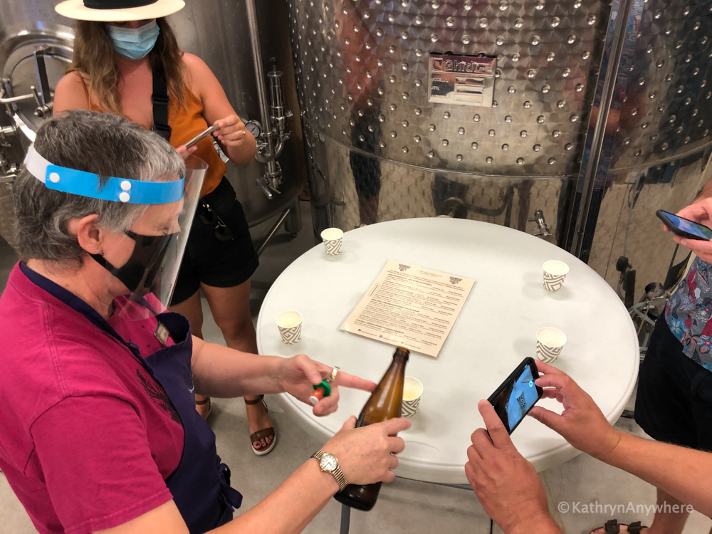 Tasting the ciders in Bonnieheath, owner is wearing a face mask and shield, safety first!