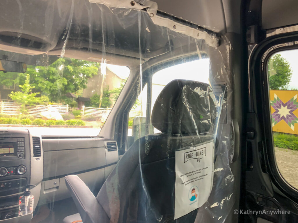 Inside the sprinter van with Ride The Bine - barrier between driver and passengers 