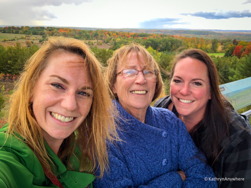 Sager Conservation Area selfie from tower, with orange, yellow and red leaves in background