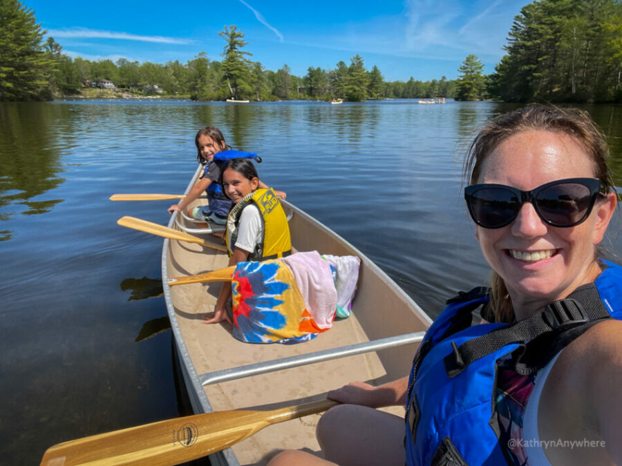Six Mile Lake Canoe Rentals. Mom and kids in canoe.