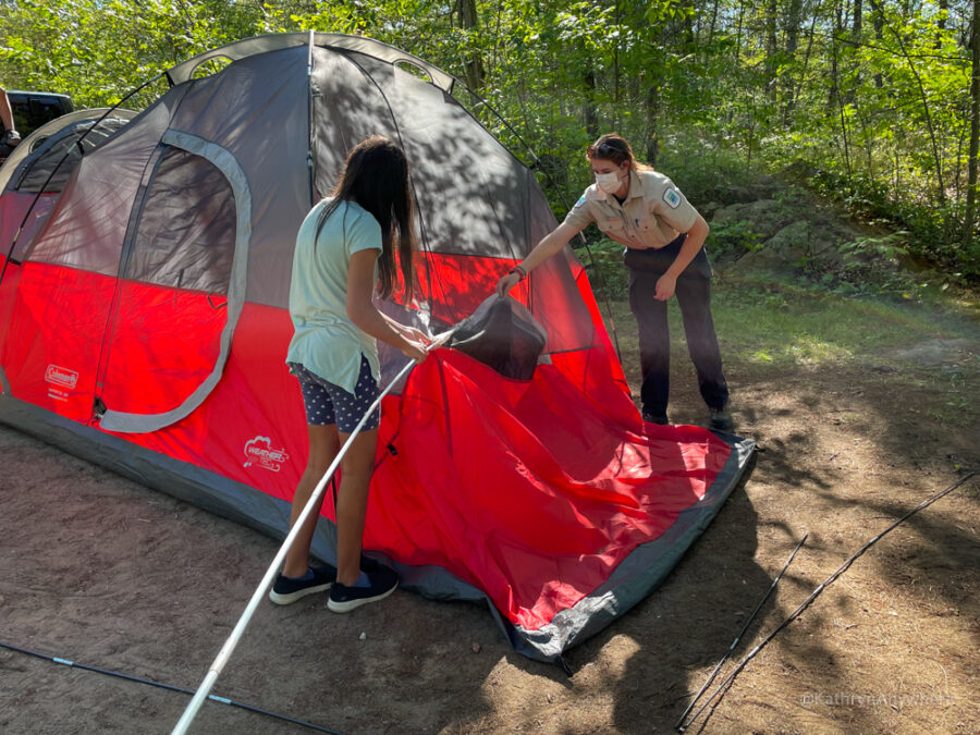 Six Mile Lake Provincial Park Learn To Camp. Putting poles through the tent to stand it upright.