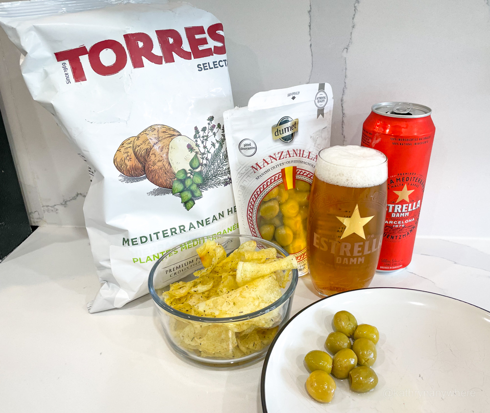 Estella Damm afternoon snack with olives and chips