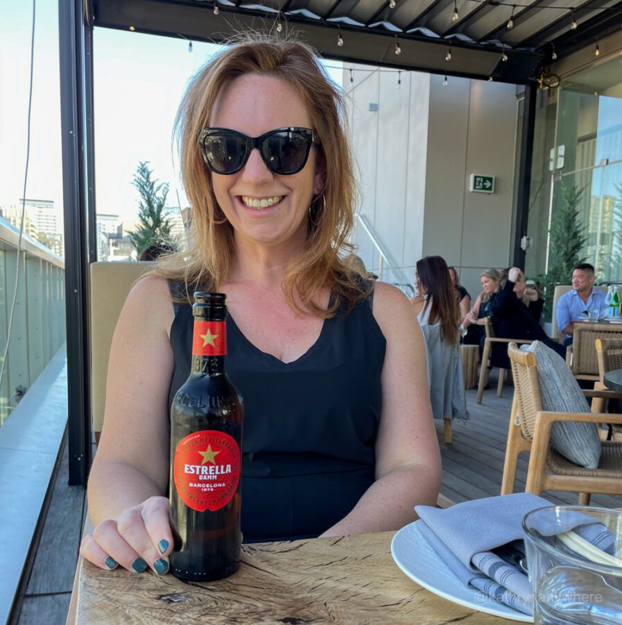 Estella Damm being enjoyed at Harriet's by the author, Kathryn