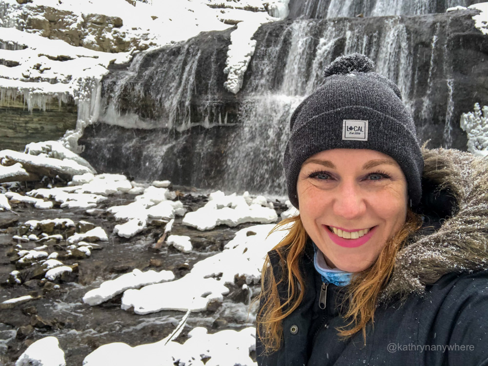 Activities Outside in Winter. Adventurous Backpacker Girl Hiking and Climbing to high mountains alone. Extreme Sports. Winter Hiking Tips