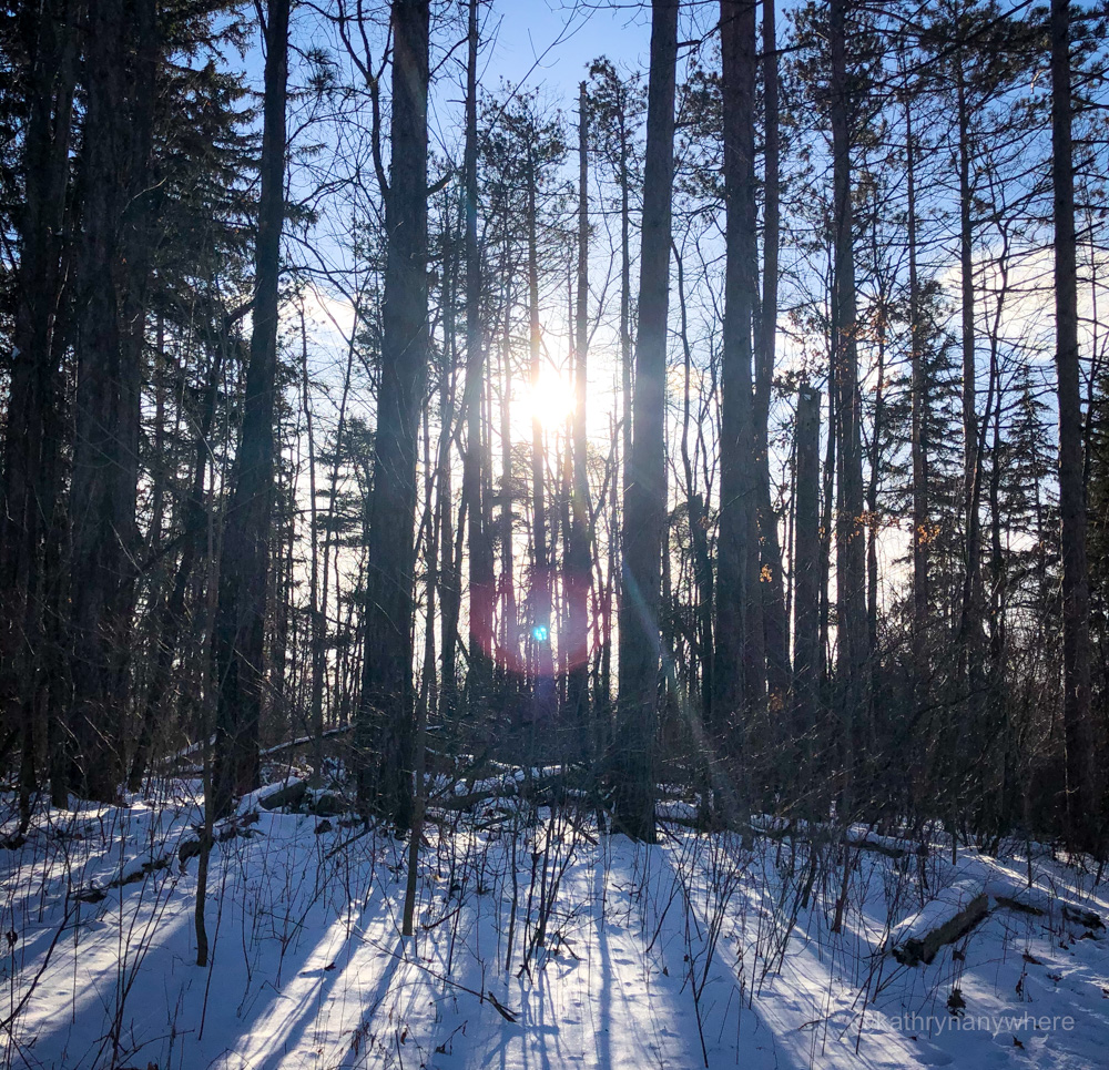 Winter hike sunbeans at sunset in Hockley Valley