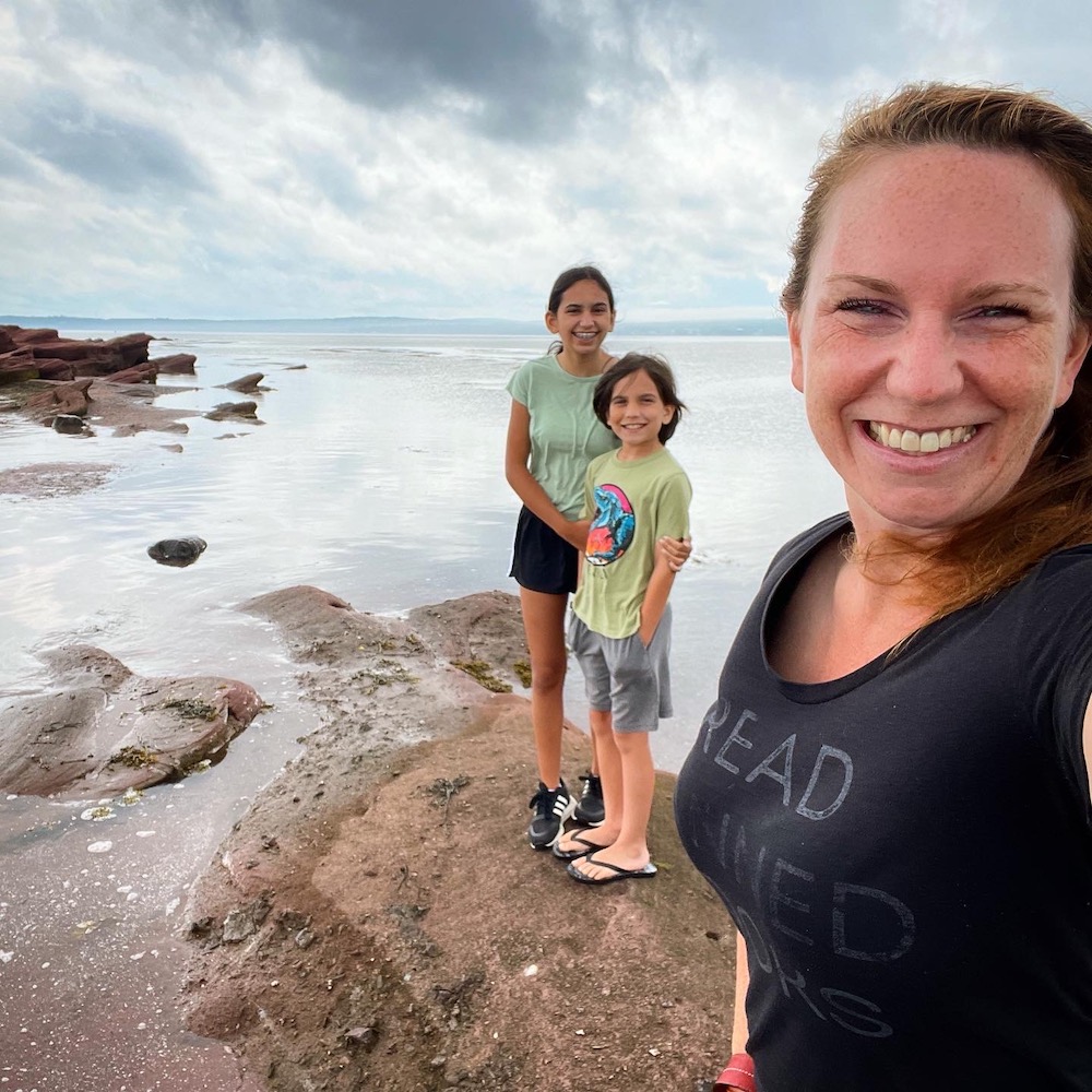 Kathrynanywhere and kids standing on Ocean Floor in New Brunswick.
