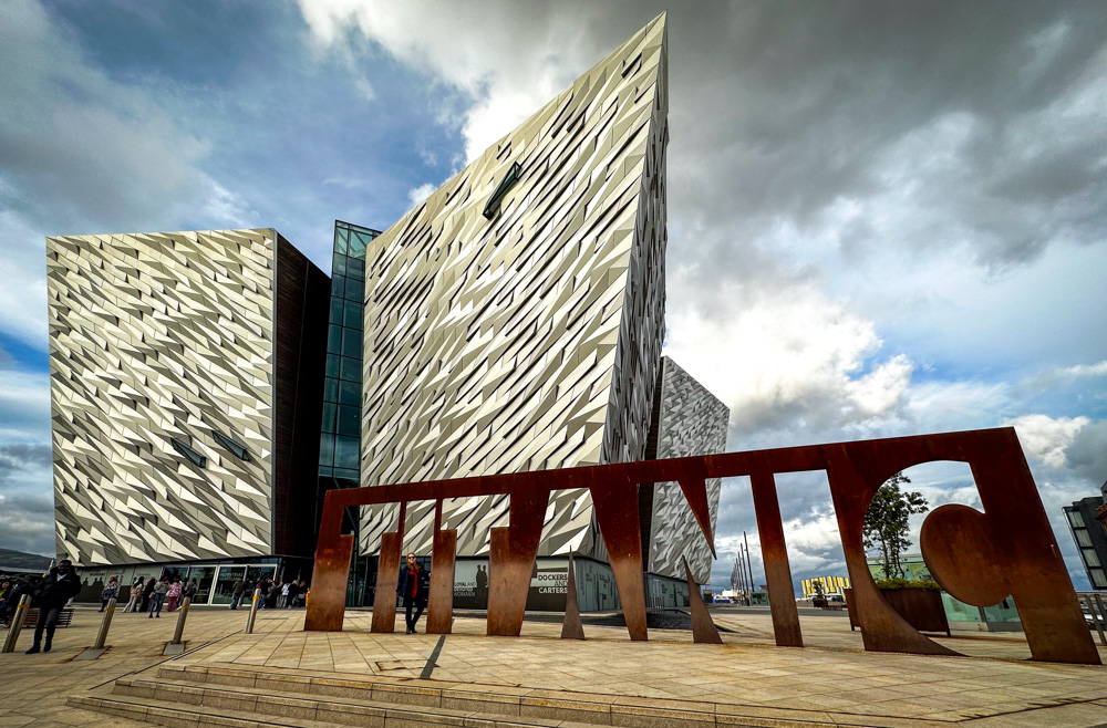 Exterior of Titanic Belfast Museum with author in the I