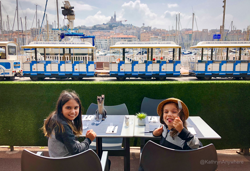 Kids on a restaurant patio in Marseille Old Port