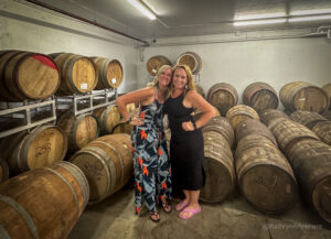 Things to do in Oka on a girlfriend getaway Kat and Lindz in Distillerie Côte des Saints basement with whisky barrels