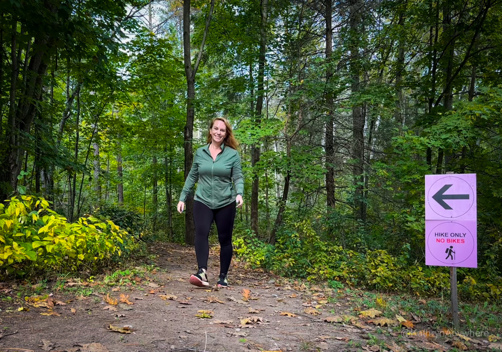 Kathryn enjoying the Trail Hub hiking trail on a fall day