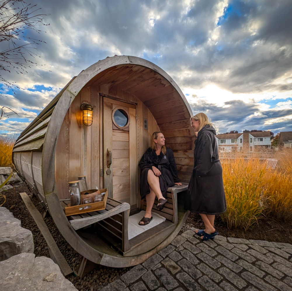 Kat and Lindz outside barrel sauna at Willowbrook Spa The Lake House Canandaigua