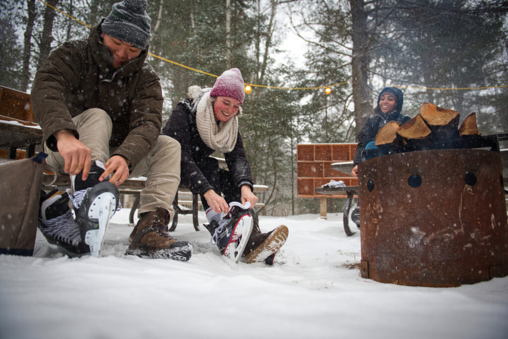 Arrowhead Provincial Park, couple lacing up skates Photo Courtesy of Ontario Parks Media Arrowhead Provincial Park<br />Photographer: Evan Holt